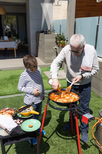 High angle view of man preparing food at restaurant