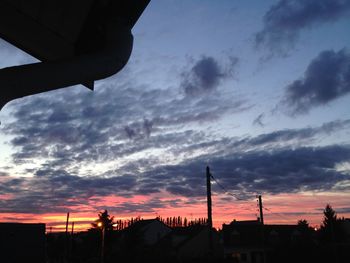 Silhouette of built structures at sunset