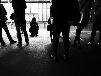 Group of people walking in subway