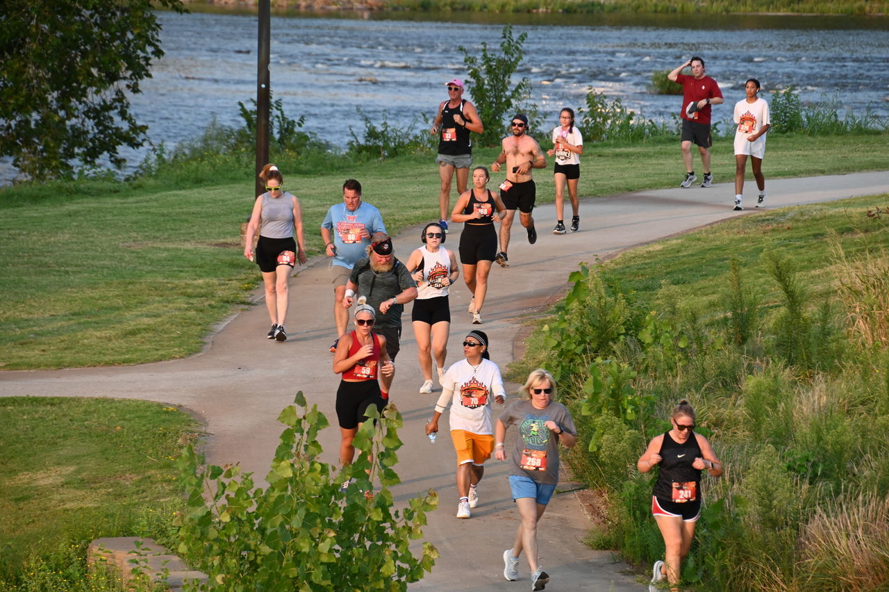 group of people, recreation, large group of people, men, water, person, crowd, running, women, sports, adult, plant, lifestyles, nature, race, full length, endurance sports, leisure activity, track and field event, footwear, day, child, high angle view, childhood, motion, group, exercising, female, togetherness, outdoors, grass, walking, competition, long distance running