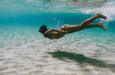 High angle view of man swimming in sea