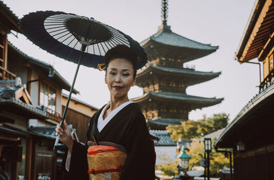 Portrait of woman standing outdoors