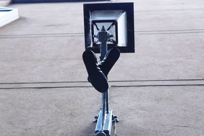 High angle view of black cat on wall