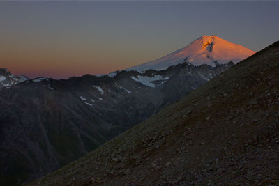 Scenic view of mountains against sky at night