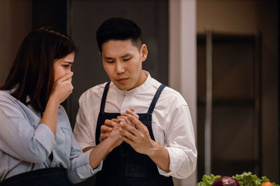 Young couple looking at camera