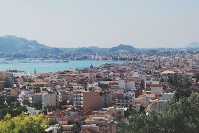 Town by sea against clear sky