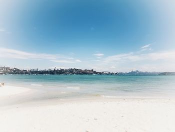 View of beach against blue sky