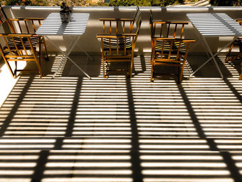 High angle view of empty chairs at restaurant