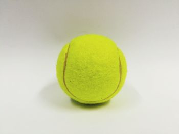 High angle view of yellow ball on white background