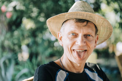 Portrait of smiling man wearing hat