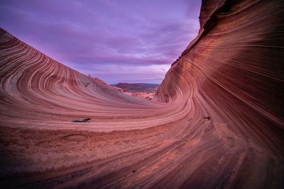 Scenic view of arid landscape against sky