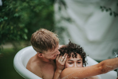 Portrait of shirtless boy in water