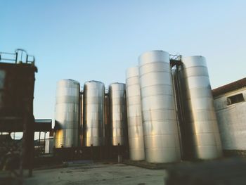 Low angle view of factory against clear sky