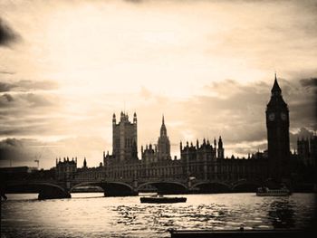 Bridge over river with city in background