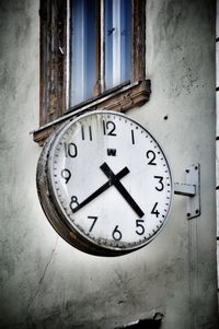 Close-up of clock on wall