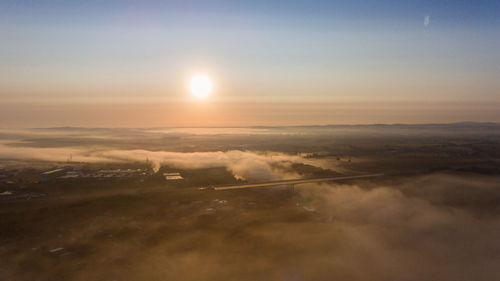 Scenic view of landscape against sky during sunset