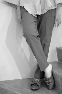 Low section of friends standing on floor