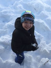 Portrait of a boy playing in snow