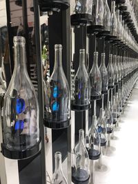 Close-up of bottles in shelf
