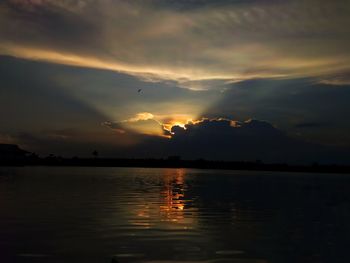 Scenic view of lake against sky during sunset