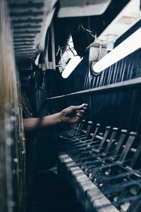 Cropped image of person using handloom