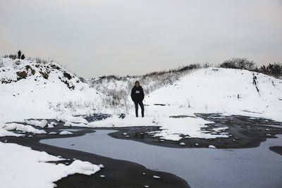 Man on snow against sky during winter