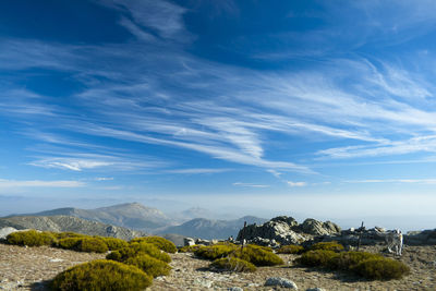 Scenic view of mountains against blue sky