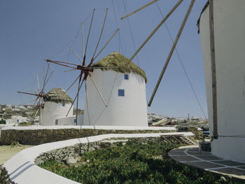 Windmills of mykonos, greece - low angle view of building against clear sky