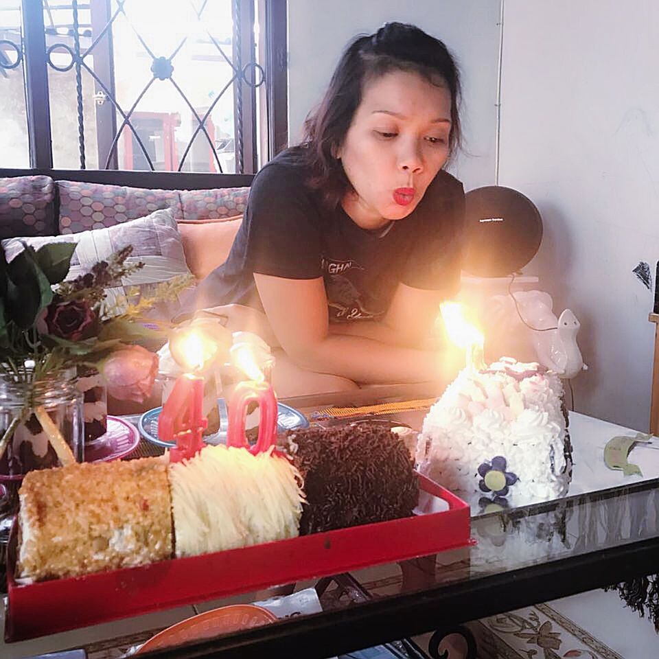 one person, burning, indoors, candle, young adult, table, real people, young women, flame, birthday cake, food, day, freshness, adult, people, adults only