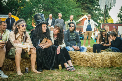 Group of people sitting outdoors