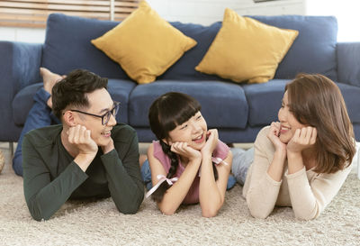 Group of people sitting on sofa