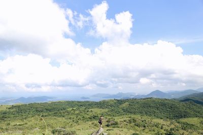 Scenic view of mountains against cloudy sky