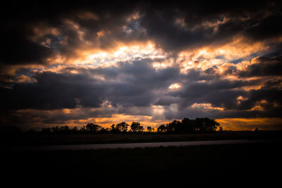 Scenic view of silhouette trees against sky during sunset