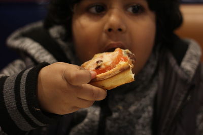 Close-up of boy eating food