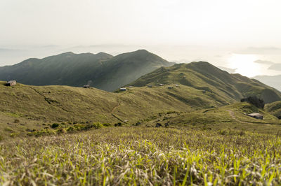 Scenic view of landscape and mountains against sky