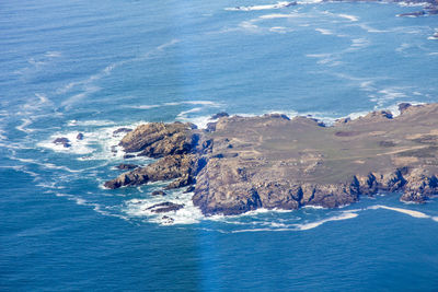 High angle view of sea against blue sky