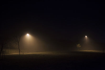 Illuminated street light at night