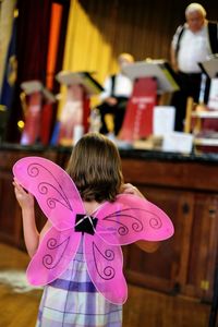 Rear view of girl with wings