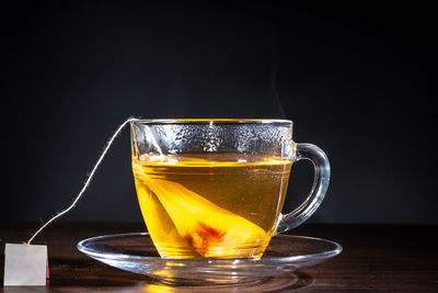 Close-up of tea in glass on table