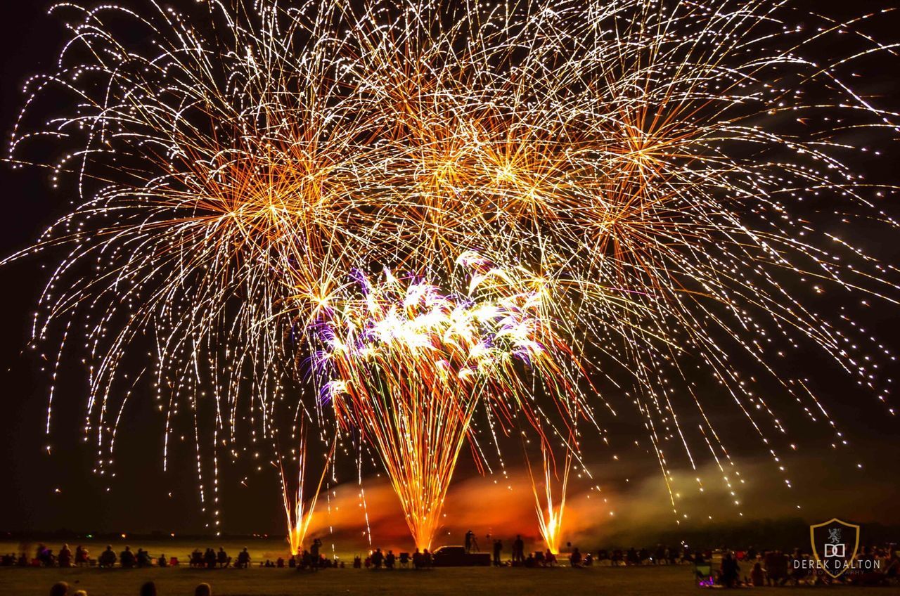 night, illuminated, celebration, firework display, arts culture and entertainment, long exposure, exploding, firework - man made object, event, motion, sparks, firework, glowing, entertainment, large group of people, sky, blurred motion, leisure activity, enjoyment