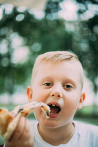 Close-up of cute baby boy eating food