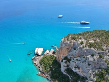 High angle view of sailboats in sea