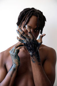 Artistic black man with painted hands