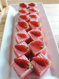 High angle view of strawberries in plate on table