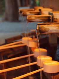 Water flowing into bamboo dipper
