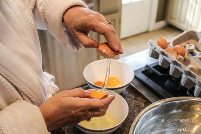 Midsection of man preparing food