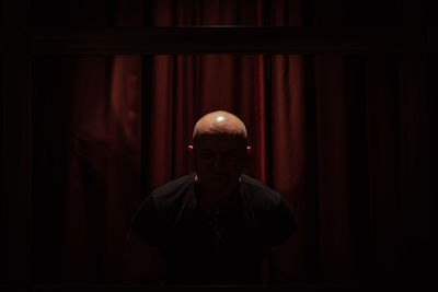 Man standing in darkroom