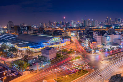 High angle view of illuminated buildings in city at night