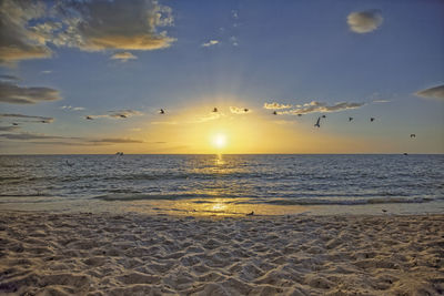 Scenic view of sea against sky during sunset