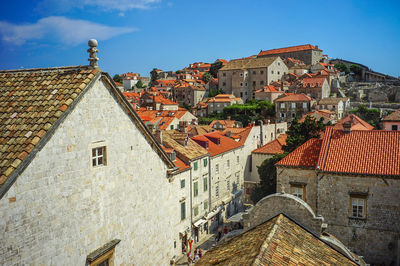 Exterior of old building in town against blue sky